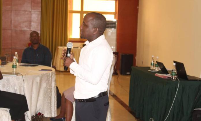 Participant of Zambia workshop speaking during the meeting