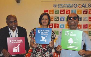 Aran Organisation of Persons with Disabilities representatives with SDG signs
