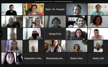 Screenshot of the webinar showing a diverse group of smiling participants.