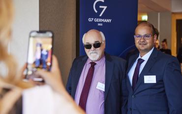 Yannis Vardakastanis posing for a picture at the G7